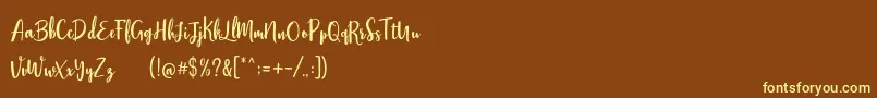 Stephanie Script Font – Yellow Fonts on Brown Background