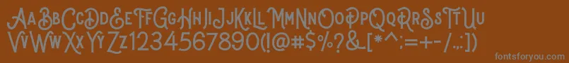Stomper Regular Font – Gray Fonts on Brown Background