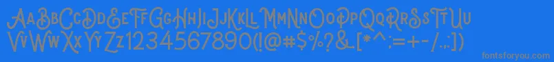 Stomper Regular-Schriftart – Graue Schriften auf blauem Hintergrund