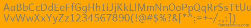 AndikaBasic-fontti – harmaat kirjasimet oranssilla taustalla