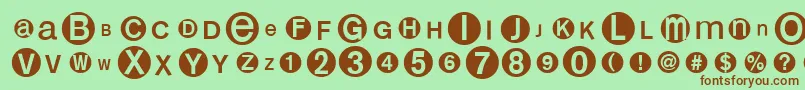 フォントMonoalphabetmultisized – 緑の背景に茶色のフォント