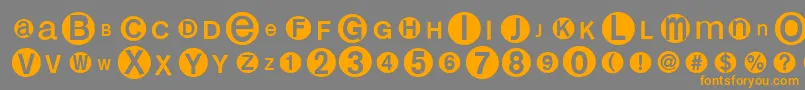 フォントMonoalphabetmultisized – オレンジの文字は灰色の背景にあります。