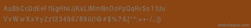 Fonte HelvcndRNormal – fontes cinzas em um fundo marrom