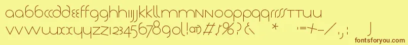 フォントTschichlight – 茶色の文字が黄色の背景にあります。