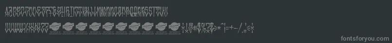MonstatagPersonaluse-fontti – harmaat kirjasimet mustalla taustalla