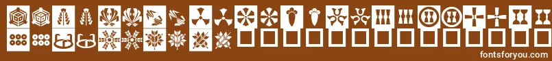 OrientPatternDingsSet3 Font – White Fonts on Brown Background