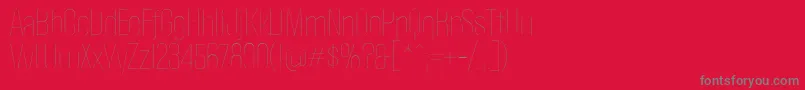 フォントPoliticaThin – 赤い背景に灰色の文字