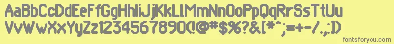 フォントPomcute – 黄色の背景に灰色の文字