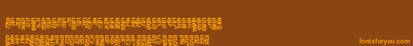 Tibetanmachineweb4-Schriftart – Orangefarbene Schriften auf braunem Hintergrund