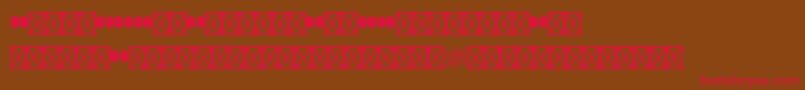 Woodtypeornamentsstd-fontti – punaiset fontit ruskealla taustalla
