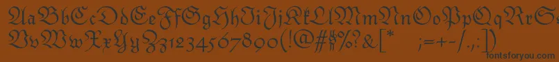 Шрифт Monarchiatext – чёрные шрифты на коричневом фоне