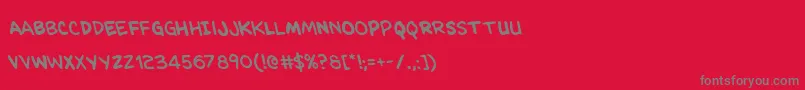 フォントKangaroocourtleft – 赤い背景に灰色の文字