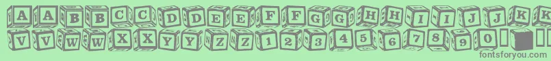 Fonte LmsLancesLetterBlocks – fontes cinzas em um fundo verde