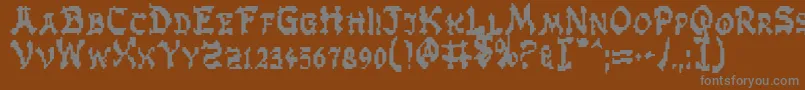 ZenMasters-fontti – harmaat kirjasimet ruskealla taustalla