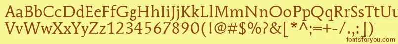 フォントItcMendozaRomanLtBook – 茶色の文字が黄色の背景にあります。