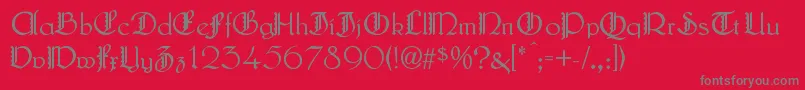 フォントLautenbachZierversalien – 赤い背景に灰色の文字
