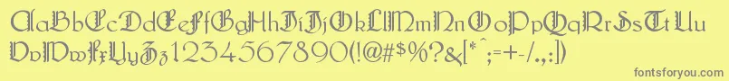 LautenbachZierversalien-fontti – harmaat kirjasimet keltaisella taustalla