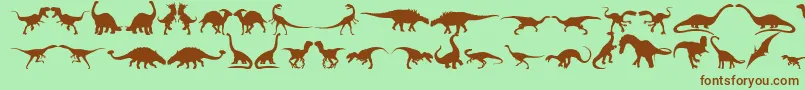 Czcionka Dingosaurs11 – brązowe czcionki na zielonym tle