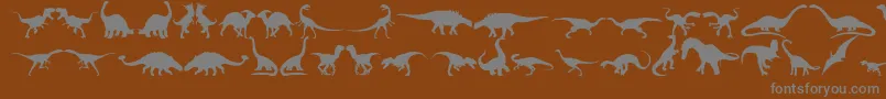 フォントDingosaurs11 – 茶色の背景に灰色の文字