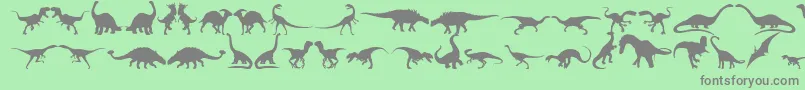 フォントDingosaurs11 – 緑の背景に灰色の文字