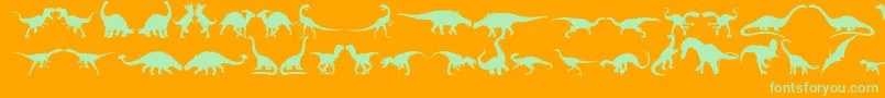 Dingosaurs11-fontti – vihreät fontit oranssilla taustalla