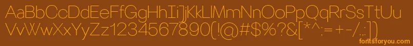 フォントVillerayThin – オレンジ色の文字が茶色の背景にあります。