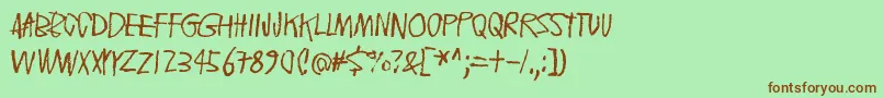 FloatingTinCan-Schriftart – Braune Schriften auf grünem Hintergrund