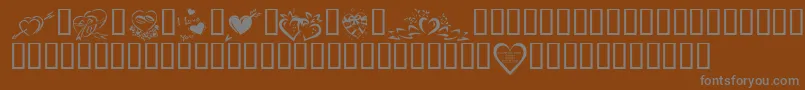 フォントKrValentines2006Four – 茶色の背景に灰色の文字