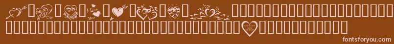 Czcionka KrValentines2006Four – różowe czcionki na brązowym tle