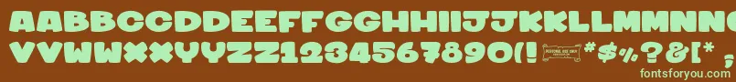 Sharkymeduza1-fontti – vihreät fontit ruskealla taustalla