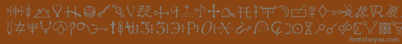 フォントAlchemyc – 茶色の背景に灰色の文字