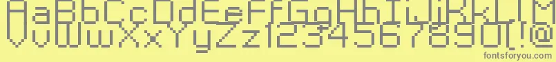 フォントKyrou9RegularXtnd – 黄色の背景に灰色の文字