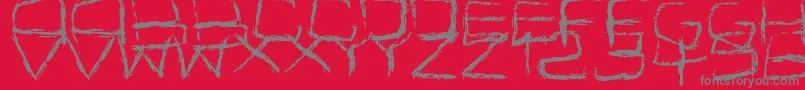 Fonte Spidery – fontes cinzas em um fundo vermelho