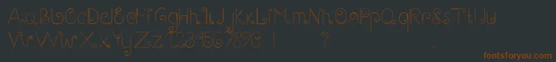 Fonte GaryScript – fontes marrons em um fundo preto