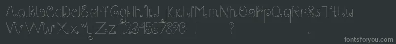 Fonte GaryScript – fontes cinzas em um fundo preto