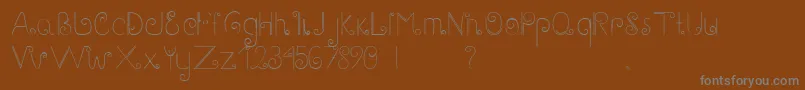 Шрифт GaryScript – серые шрифты на коричневом фоне