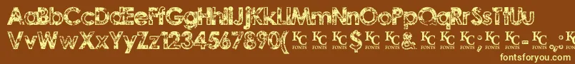 TragicvisiondemoKcfonts-fontti – keltaiset fontit ruskealla taustalla