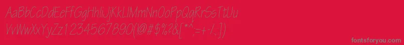 フォントEskiztwolightcondcItalic – 赤い背景に灰色の文字