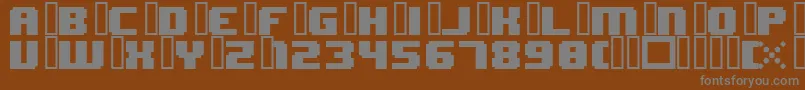 Czcionka 8bitWonderNominal – szare czcionki na brązowym tle