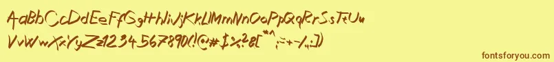 Fonte XaligraphyItalic – fontes marrons em um fundo amarelo