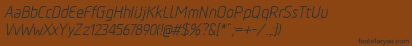 Шрифт TadaoItalic – чёрные шрифты на коричневом фоне
