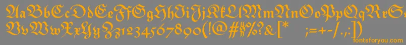 フォントMonarchiatextBold – オレンジの文字は灰色の背景にあります。