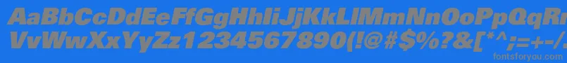 PartnerblackItalic-fontti – harmaat kirjasimet sinisellä taustalla