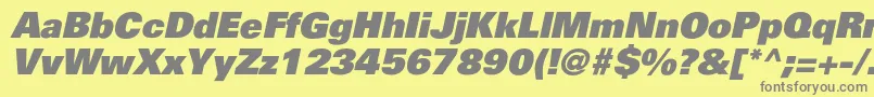 PartnerblackItalic-fontti – harmaat kirjasimet keltaisella taustalla