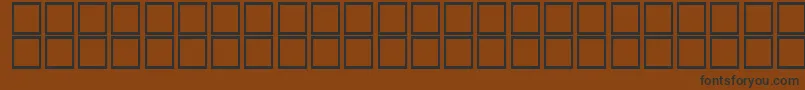 フォントThulthBold – 黒い文字が茶色の背景にあります