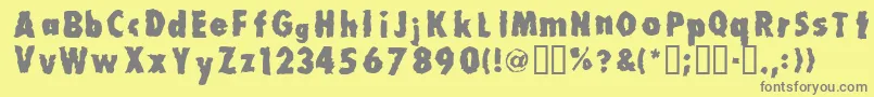 フォントMillionair – 黄色の背景に灰色の文字