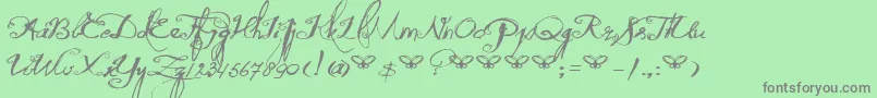 DkQuiltedButterfly-Schriftart – Graue Schriften auf grünem Hintergrund