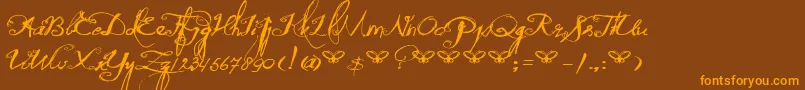 DkQuiltedButterfly-Schriftart – Orangefarbene Schriften auf braunem Hintergrund