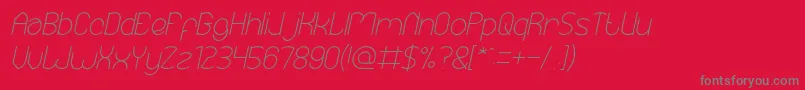 Fonte EssentialArrangementItalic – fontes cinzas em um fundo vermelho