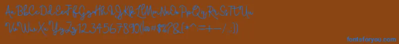 Skolateka-Schriftart – Blaue Schriften auf braunem Hintergrund